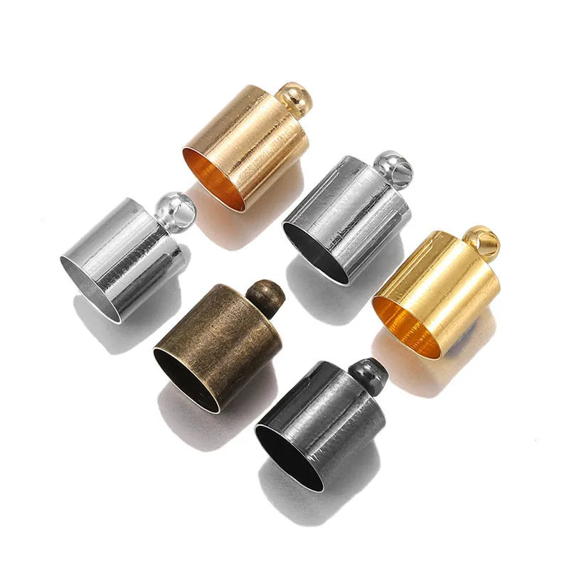 Assorted copper caps in gold, silver, black, and bronze finishes for jewellery making