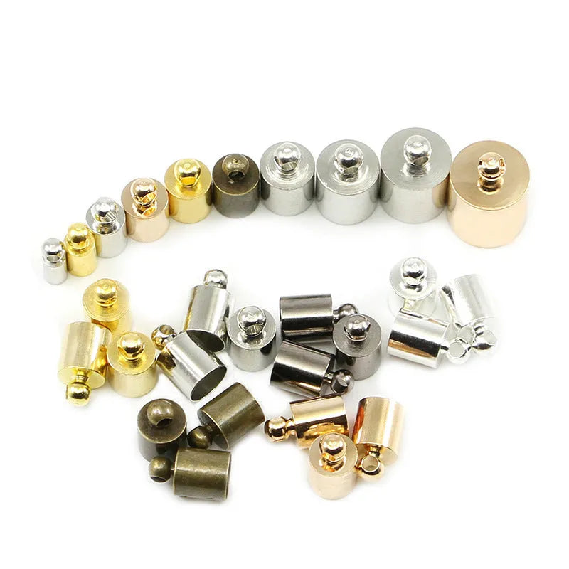 Assorted copper caps in gold, silver, black, and bronze finishes for jewellery making