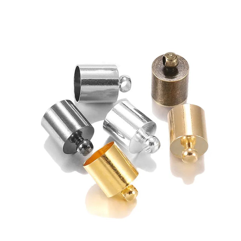 Assorted copper caps in gold, silver, black, and bronze finishes for jewellery making