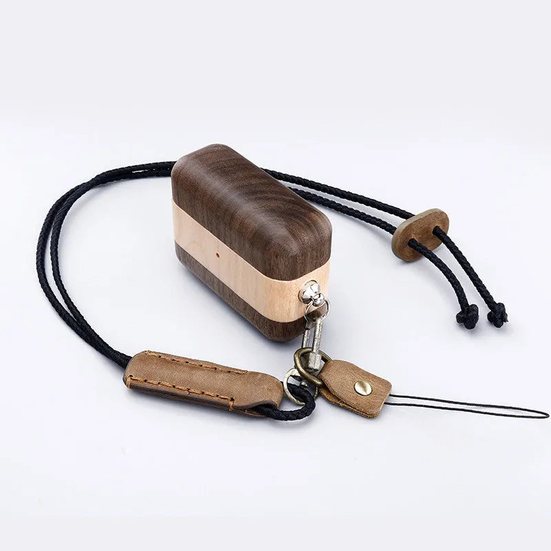 Solid wood hard shell protective case for wireless Bluetooth earphones, shown in a natural wood finish.