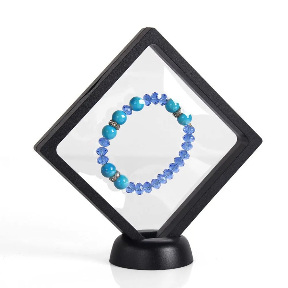 Transparent 3D floating display case holding a coin, with black and white size options