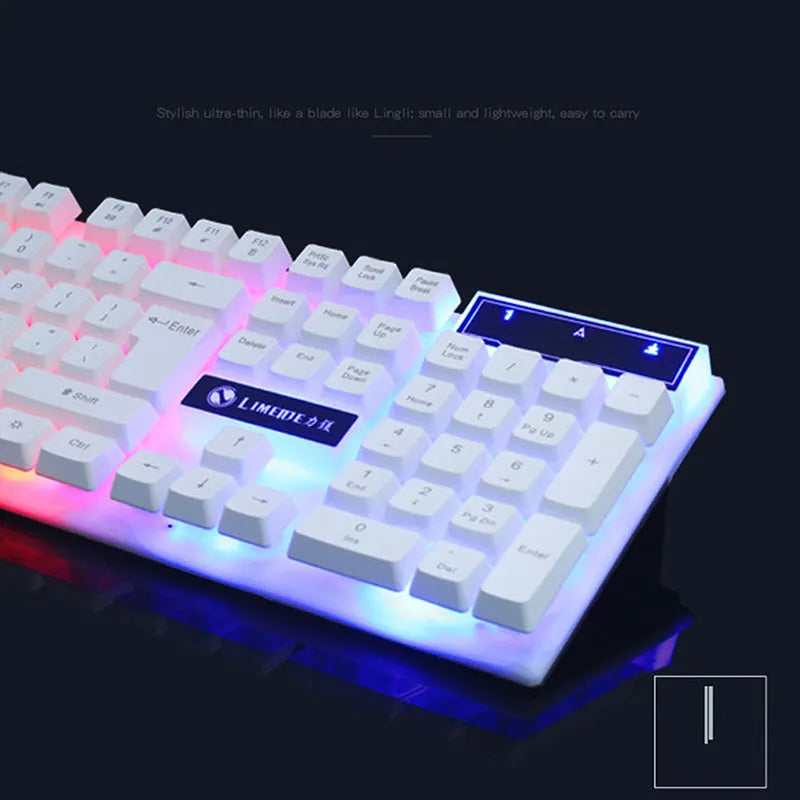 GTX300 wired USB gaming keyboard and mouse set with colour backlit keys in black on a desk.
