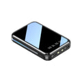 Compact white power bank with digital display screen showing battery percentage, measuring 94mm