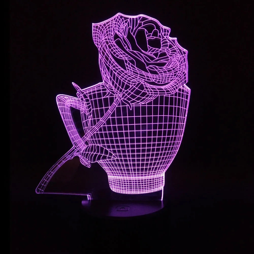3D rose flower night light with colour-changing LED and remote control on a black base.