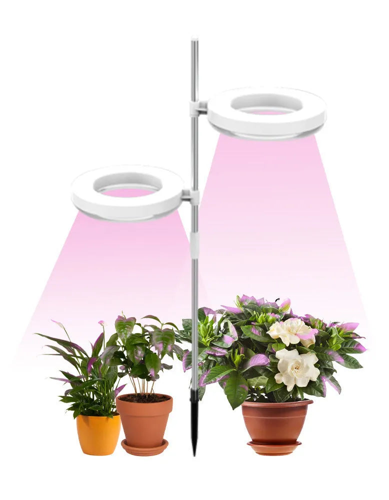 Compact full spectrum plant growth lamp with a polycarbonate shell on a desk.