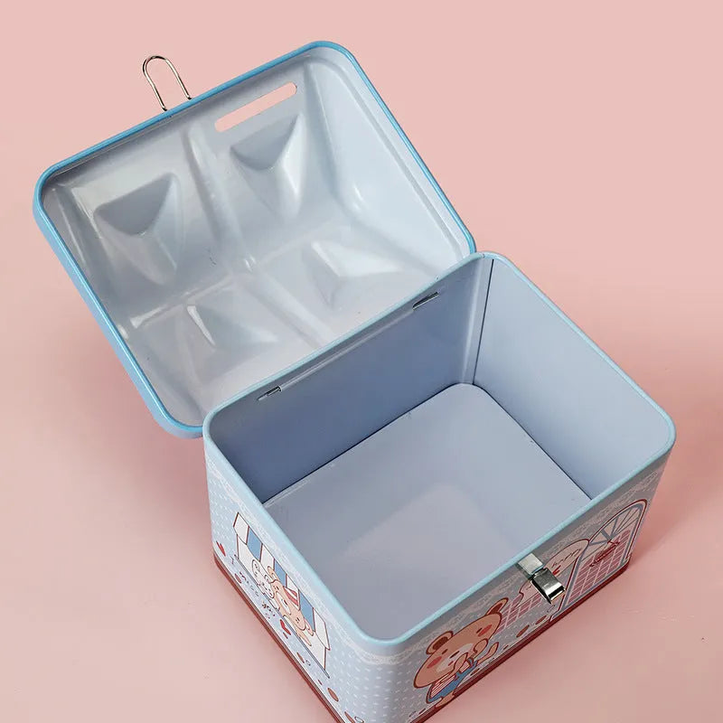 Blue house-shaped tinplate piggy bank with coin slot on removable lid