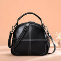 Genuine cowhide leather round handbag with soft handle and zipper closure