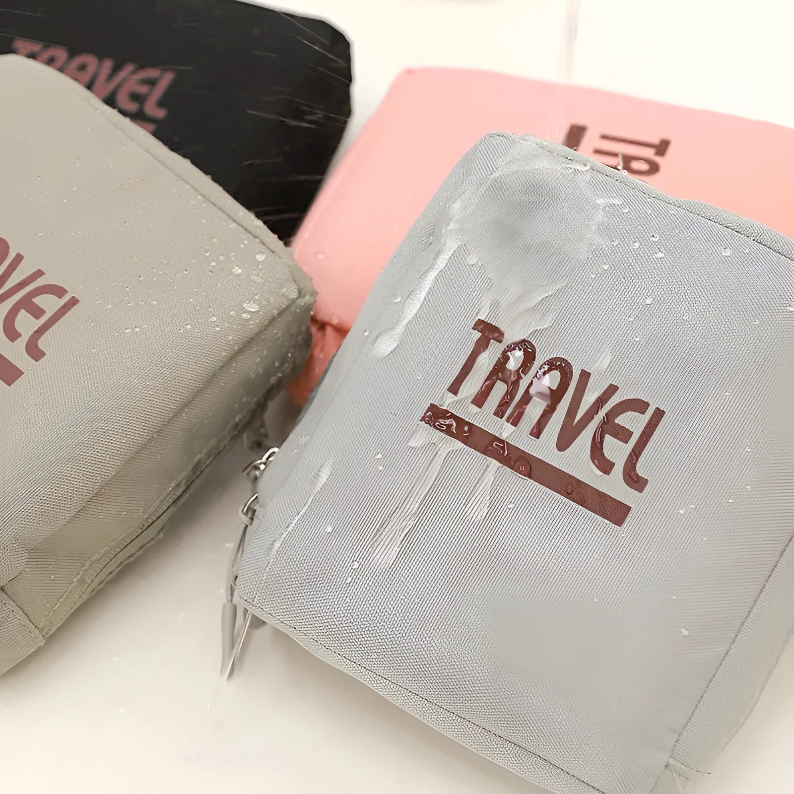 Cube-shaped travel storage bag in 300D Oxford cloth available in black, gray, khaki, and pink colours