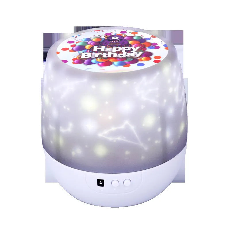 Compact plastic starry sky projector lamp showing cosmic projection on wall.