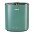 Green portable mini automatic washing machine for underwear and travel on a white surface.