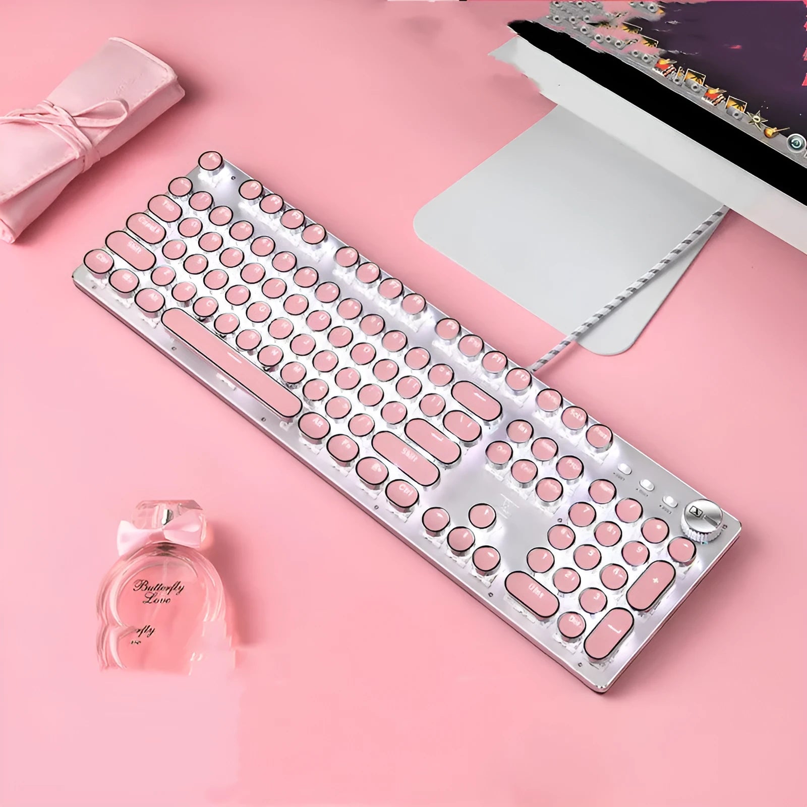 Silver and pink mechanical keyboard with green switches and USB cable connection