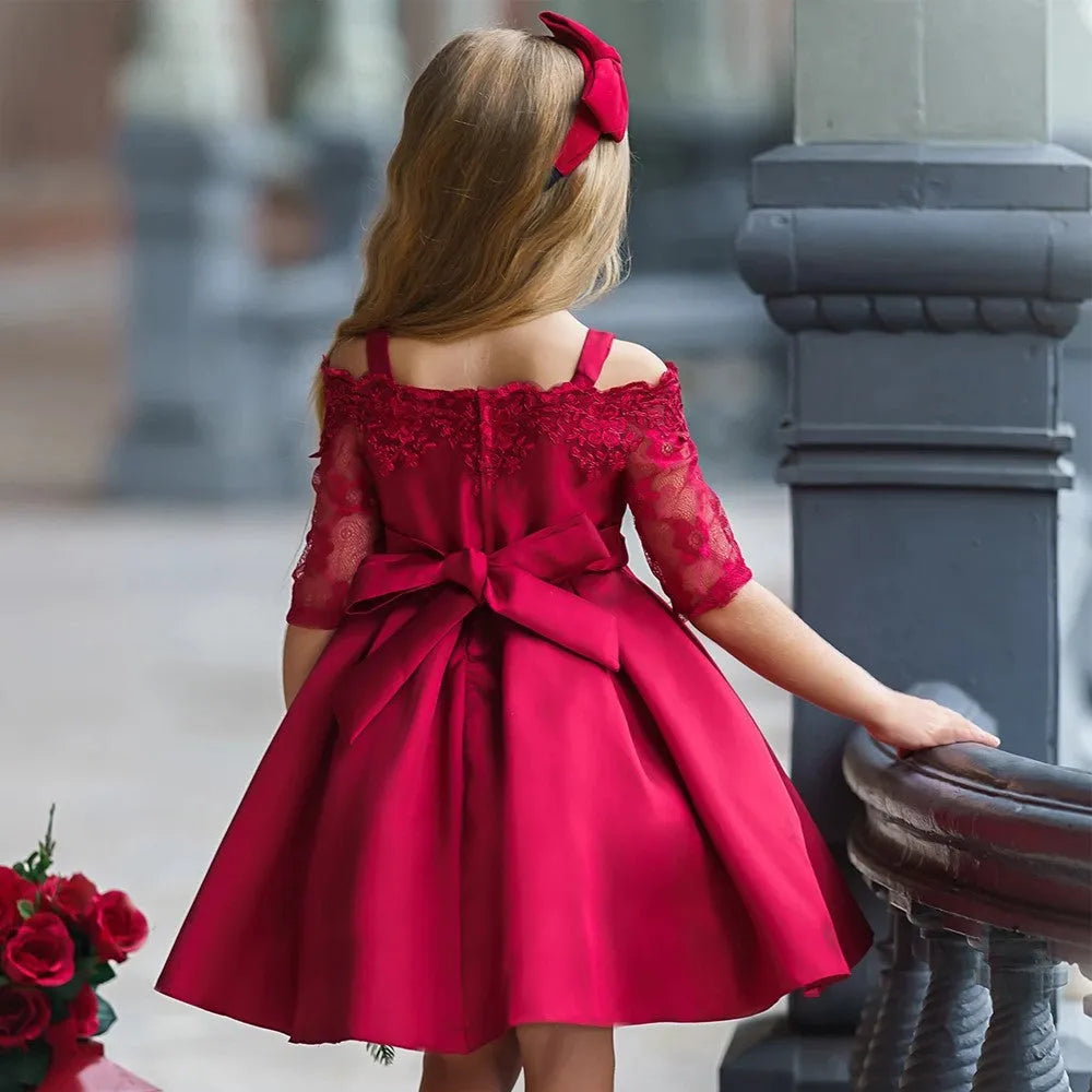 Girls lace dress in polyester fibre available in colours deep red, pink, green, red, and white.