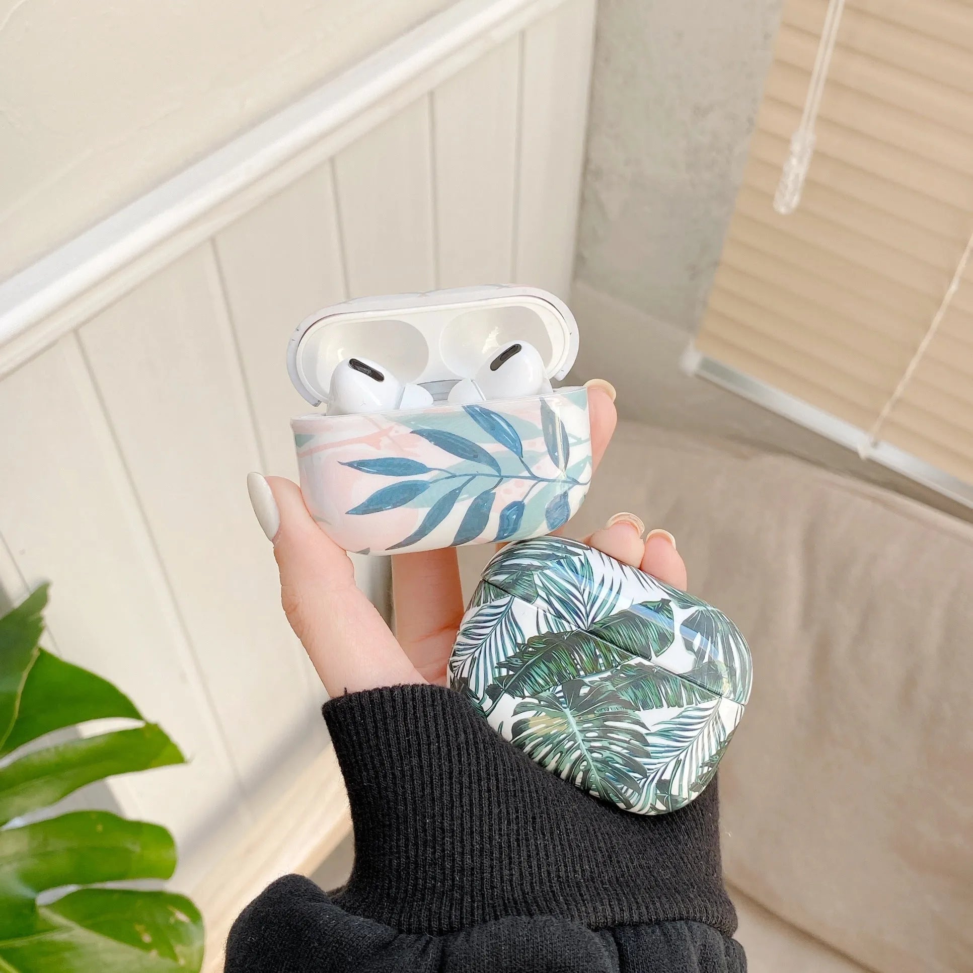 Blue and Green banana leaves pattern soft TPU protective case for Apple AirPods.