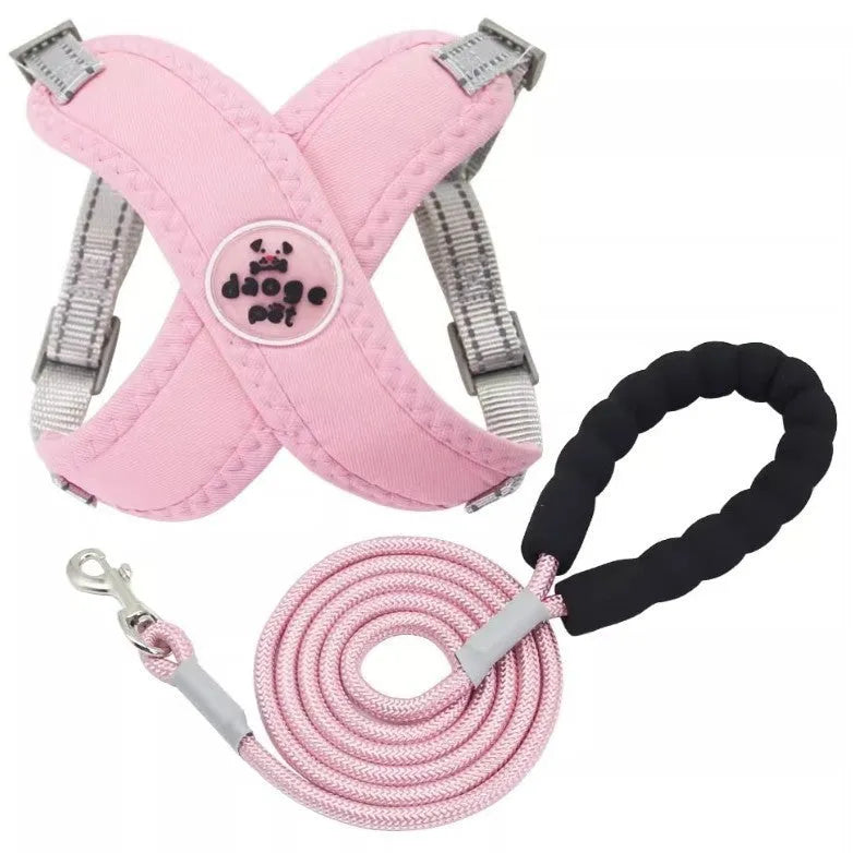 Pink adjustable dog vest harness and matching rope lead set on a white background.