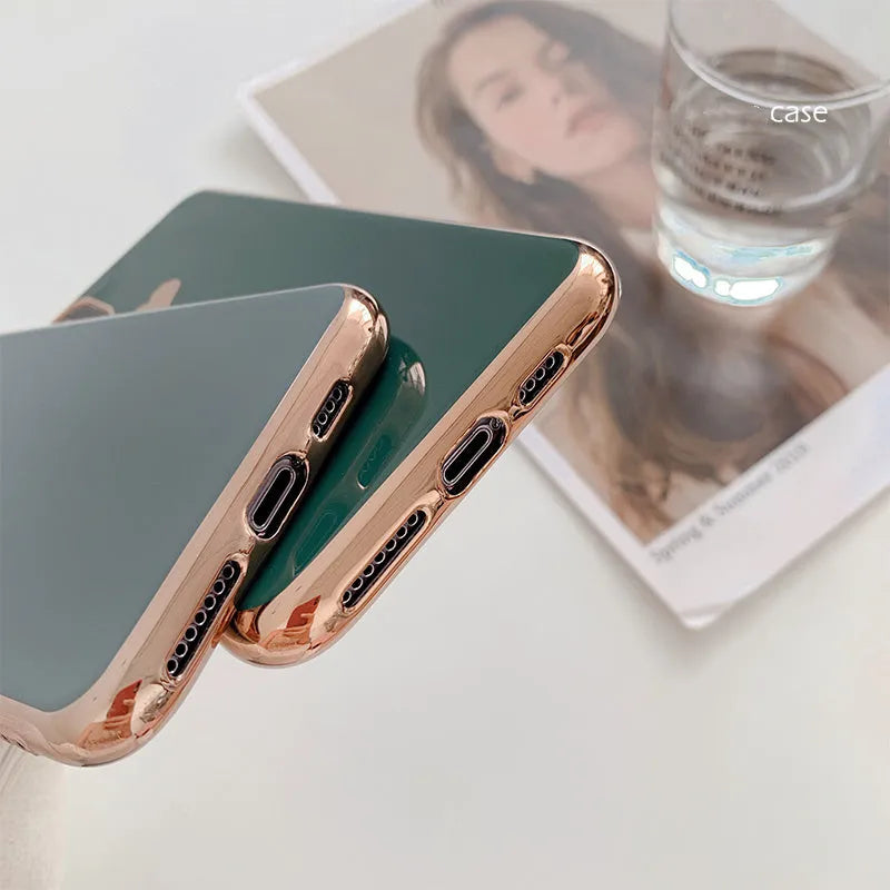 Solid colour blue TPU iPhone back cover case shown next to a claret pink and green version.