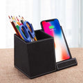 Leather desk organiser with pen holder and wireless phone charging surface