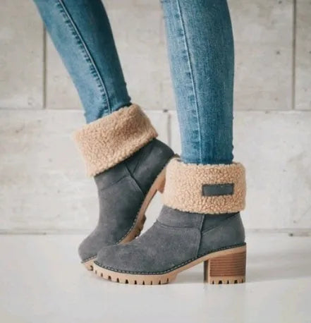 Women's suede mid-calf snow boots in black with a thick flat heel and round toe.