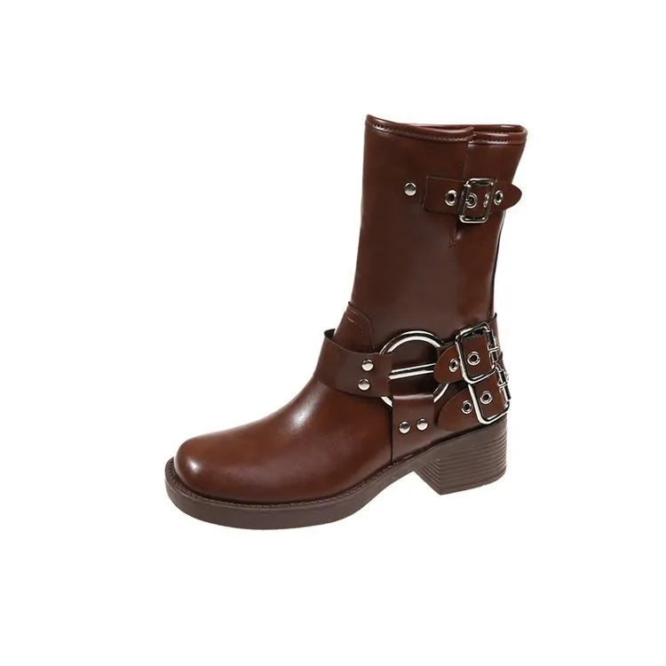 Women's black platform boots with belt buckle decoration showing mid-calf height