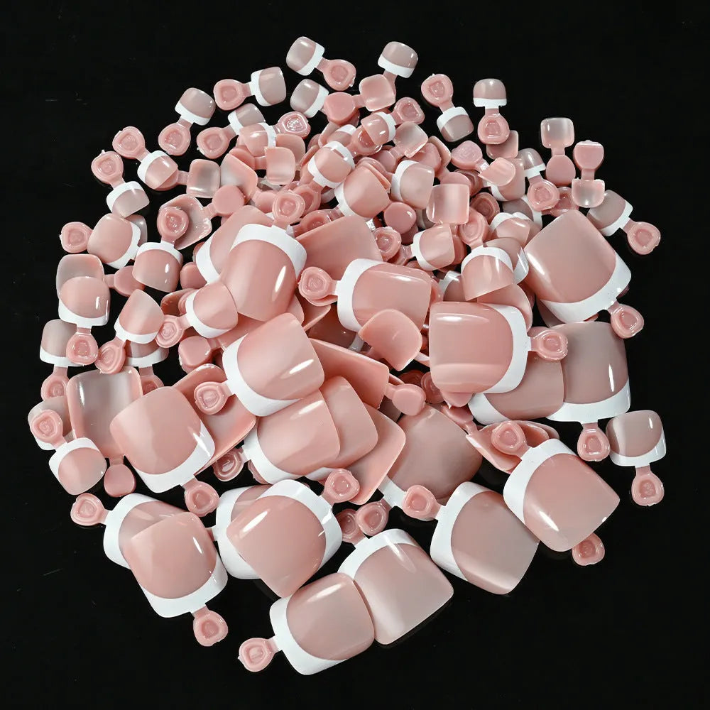 Box of 120 French manicure style nail pieces with white edges in nine nude colours, square short shape for toes.