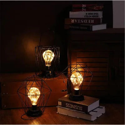 Minimalist hollow table lamp with wrought iron shell in red wine glass style emitting warm white LED light
