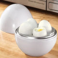 White microwave egg steamer in egg shape with lid, holds up to 4 eggs for hard or soft boiled cooking