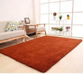 White rectangular plush area rug showing soft velvet surface and non-slip dot-patterned bottom