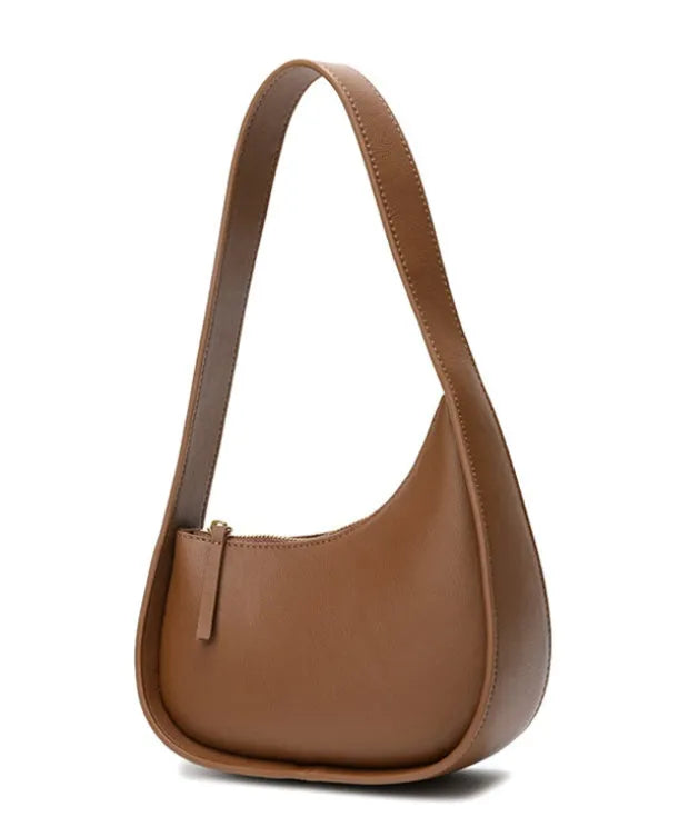 Genuine leather ladies shoulder bag in half moon shape with wide strap