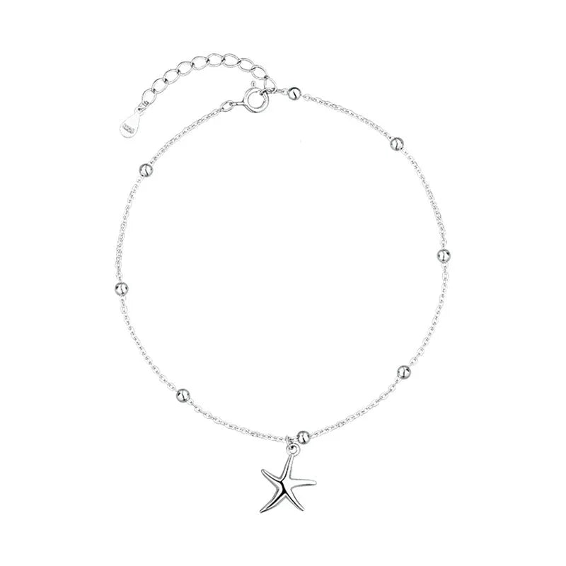 Sterling silver starfish charm anklet with round beads on an adjustable chain.