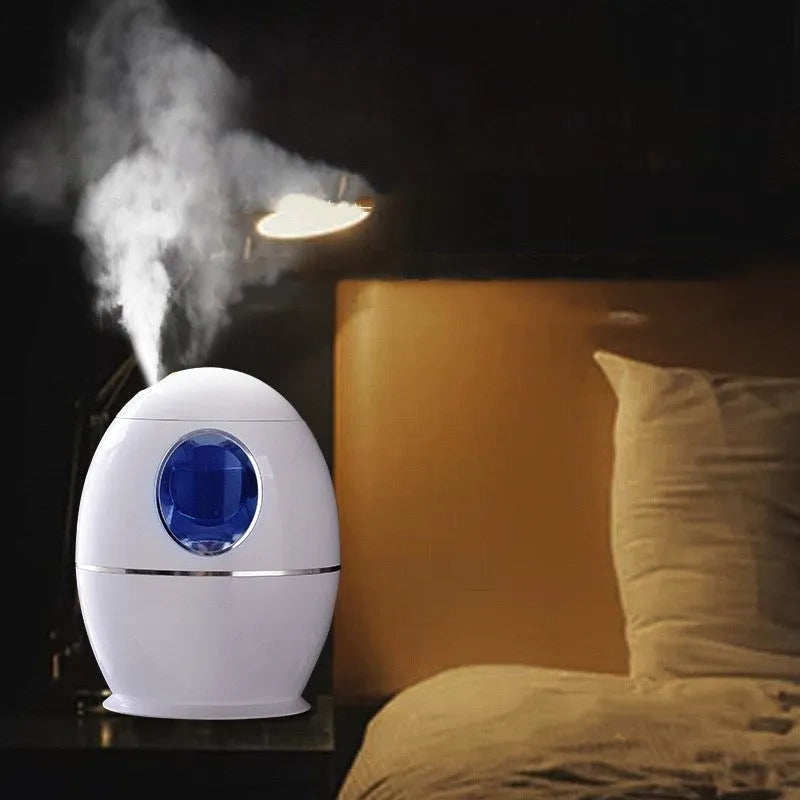 White columnar household mute air disinfection humidifier with single fog outlet on a wooden table
