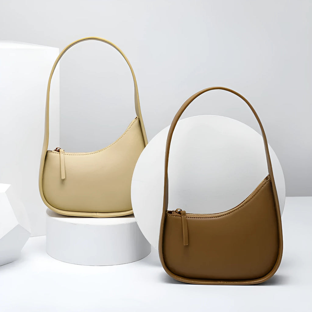 Genuine leather ladies shoulder bag in half moon shape with wide strap