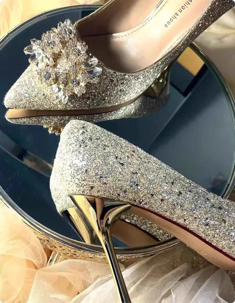 Champagne Xiuhe wedding shoes with rhinestones, pointed toe, fine heel, and one foot kick closure.