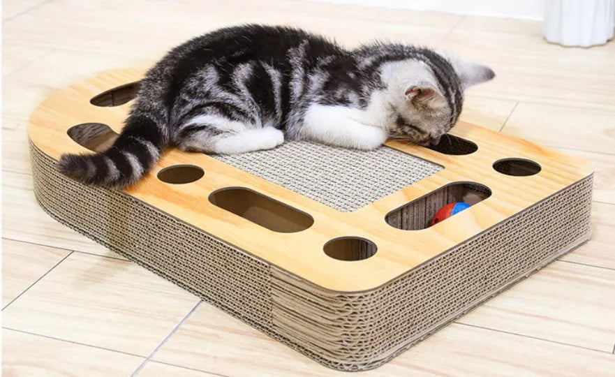 Brown corrugated cat scratch board with attached ball measuring 50.5x30.5x6cm