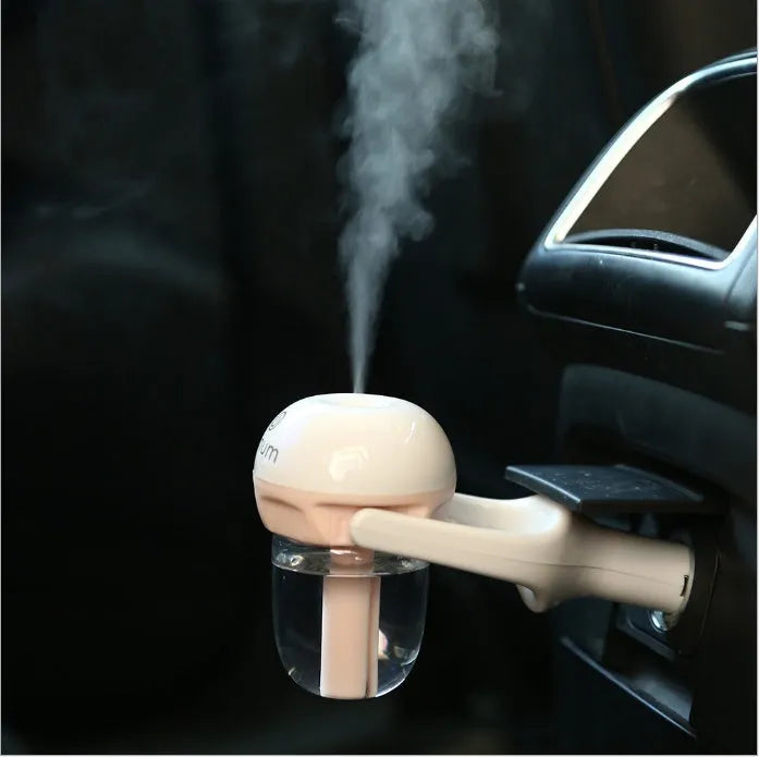 Portable mini car humidifier and essential oil diffuser with rotating nozzle in multiple colours.