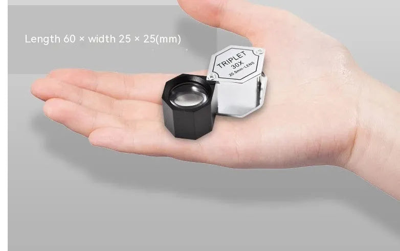 Handheld portable magnifying glass with metal housing and optical glass lens for jewellery inspection