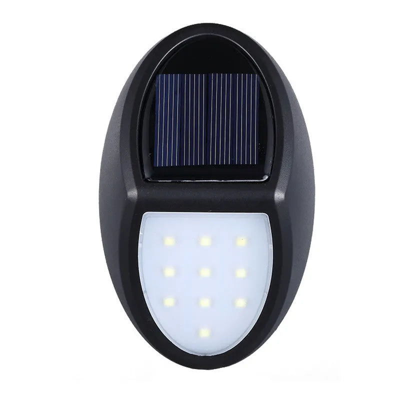 Black solar-powered wall light with automatic sensor for garden and outdoor security lighting