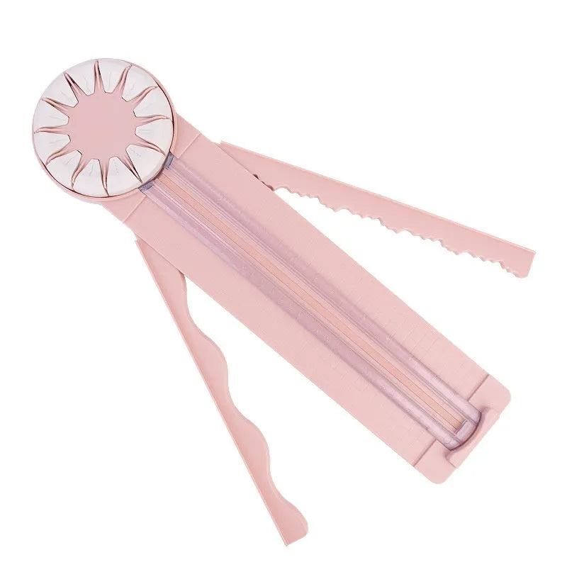 Pink plastic paper cutting machine with 12 pattern functions measuring 46.2 cm long