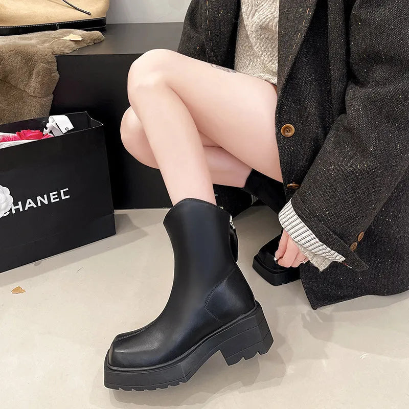 Black square toe women's platform Martin boots with a high heel and back zipper.