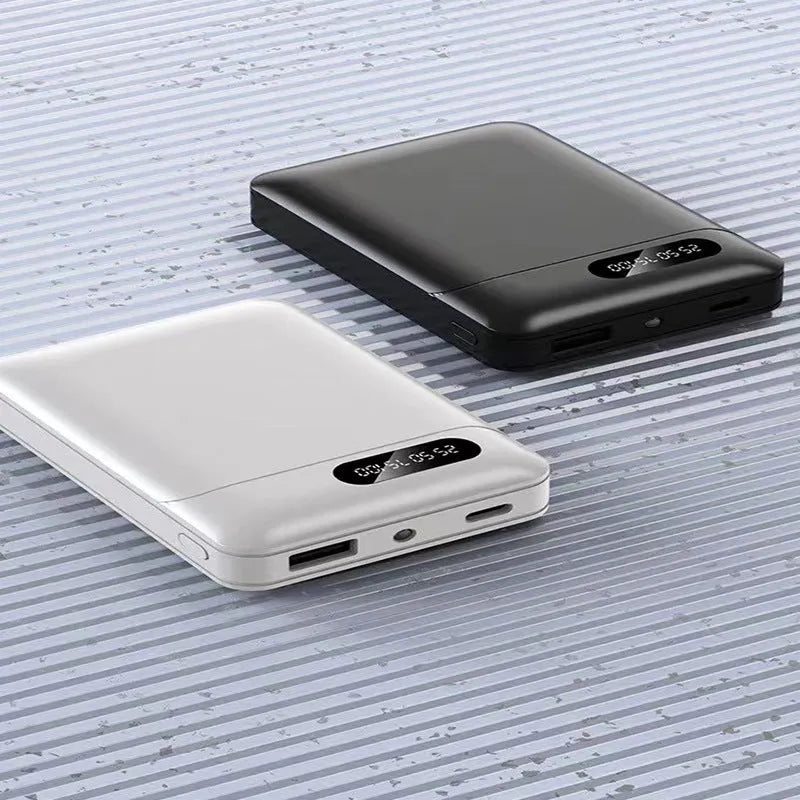 Black or white portable power bank with multi USB ports, showing dimensions of 92mm by 63mm.