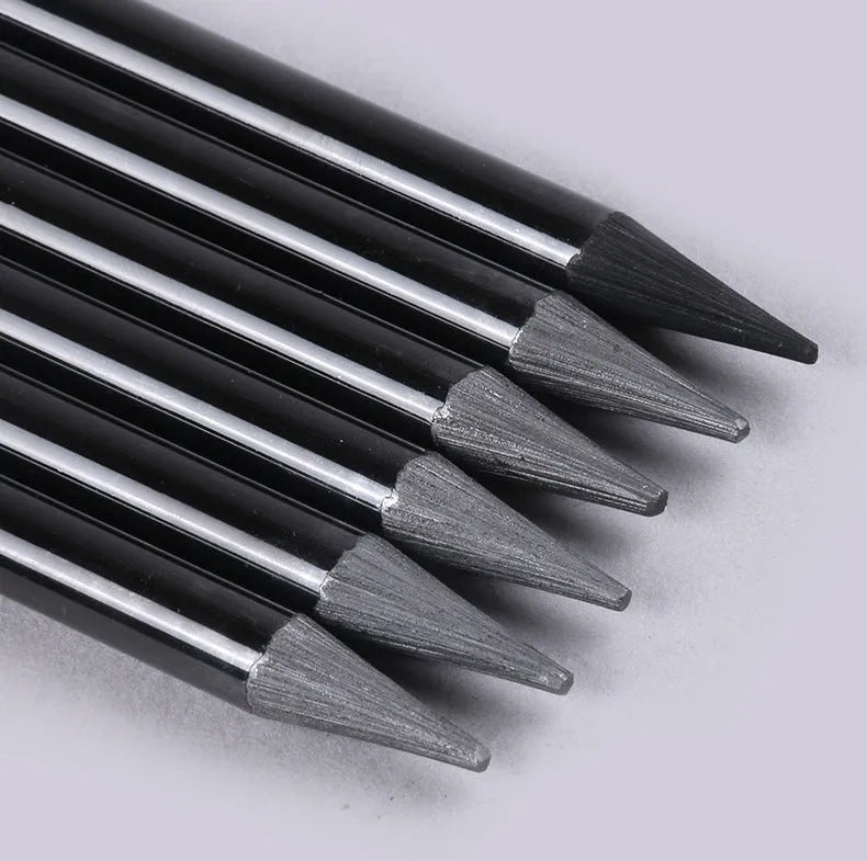 Set of nine graphite and carbonised wooden drawing pencils displayed on a suction card packaging.