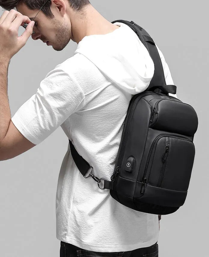 Black medium capacity outdoor shoulder bag with air cushion strap and multiple compartments