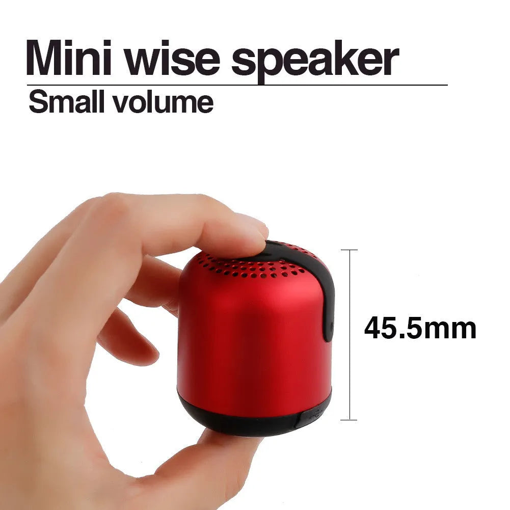 Hieha XQ11 cylindrical mini Bluetooth speaker in silver metal finish, showing compact size.