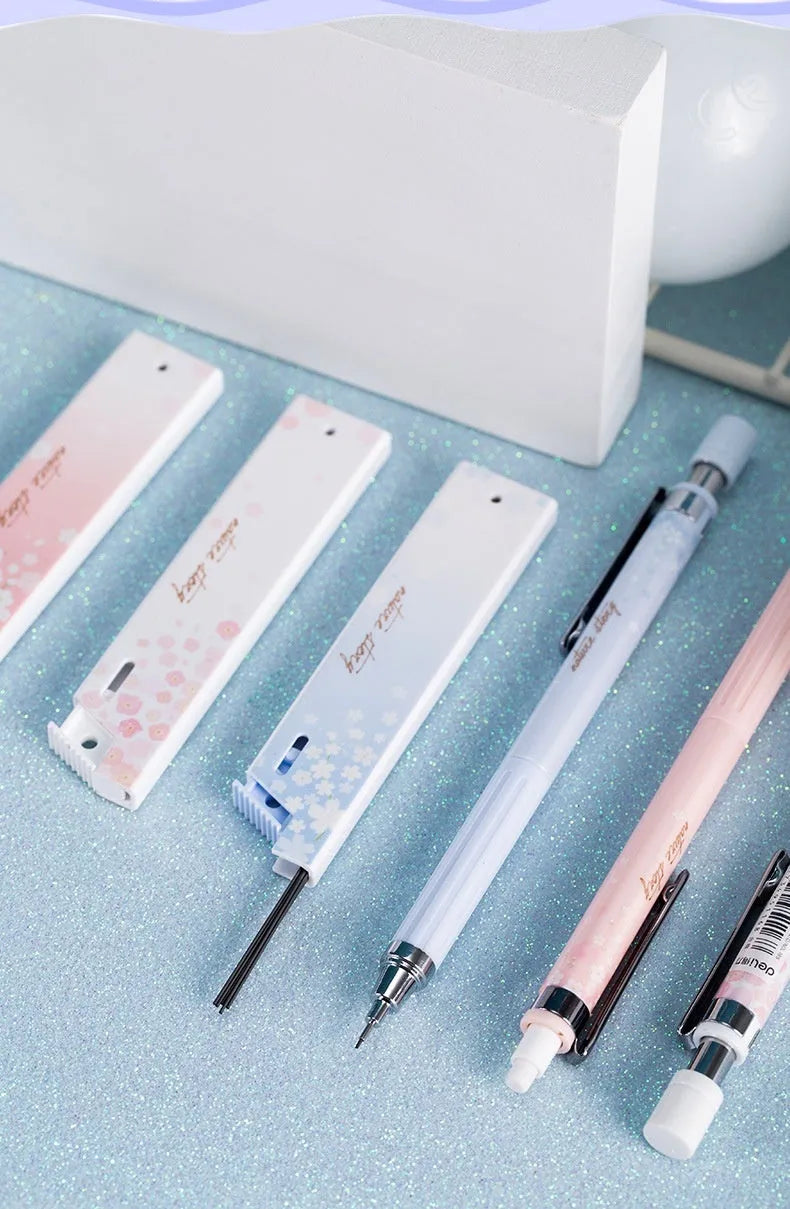 Set of three cartoon-style 0.5mm automatic pencils and boxes of HB lead refills.