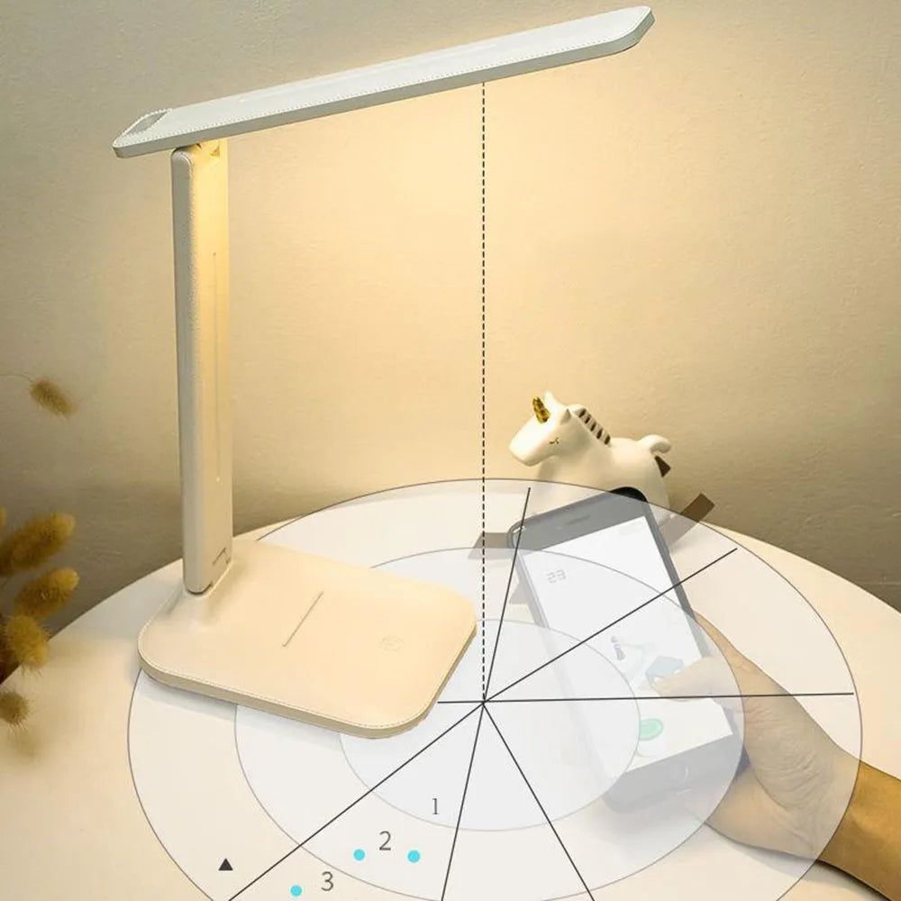 White USB rechargeable bedside lamp with touch dimming control on a wooden table.