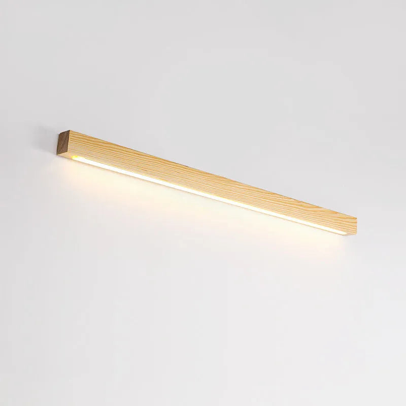 Modern walnut-colour wooden log strip LED wall lamp mounted on a wall.