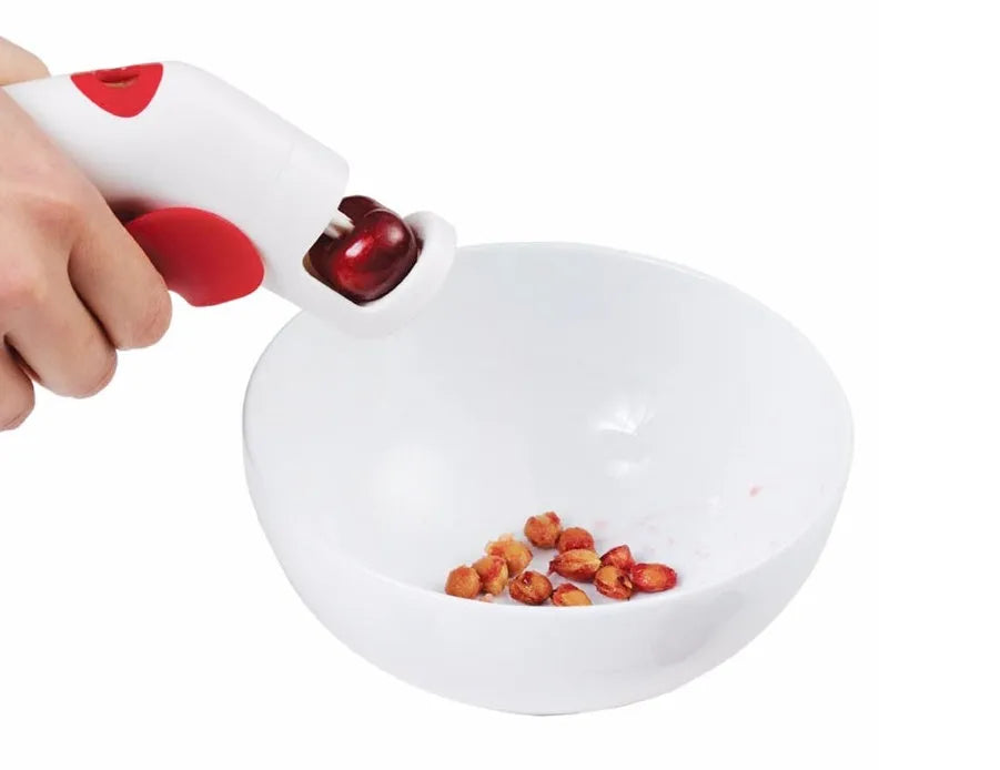 Cherry kernel remover creative kitchen gadget with comfortable handle on white background