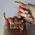 Leopard print butterfly design false nail set in WM296 colour, plastic manicure pieces