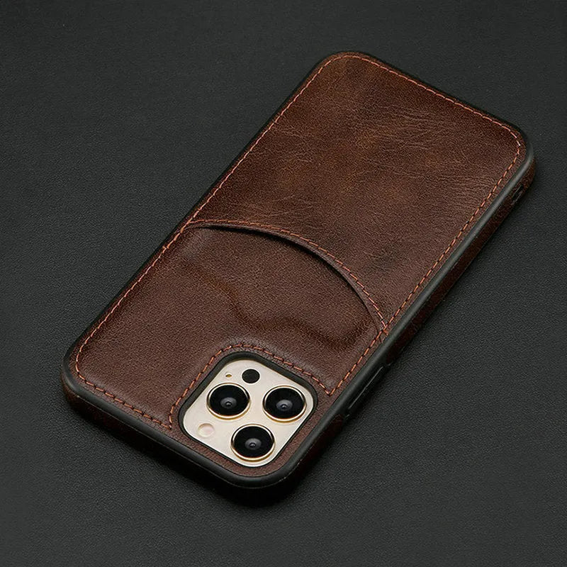 Dark blue PU leather protective case fitted on an iPhone 14 Pro Max smartphone.