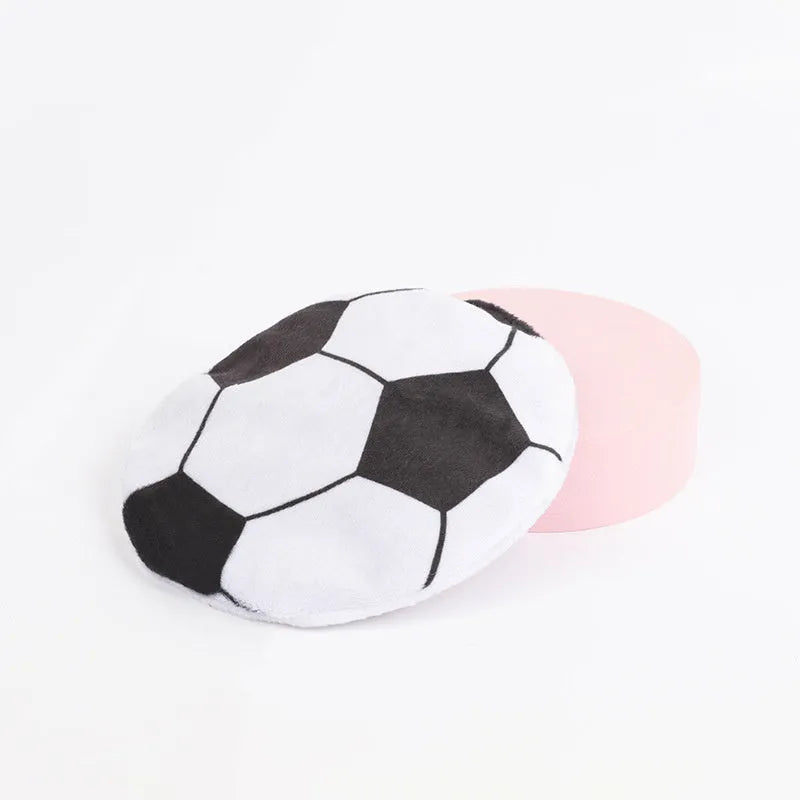Small, flat, plush flying disc cat toy with a sport ball pattern, containing catnip and a crinkle sound element.