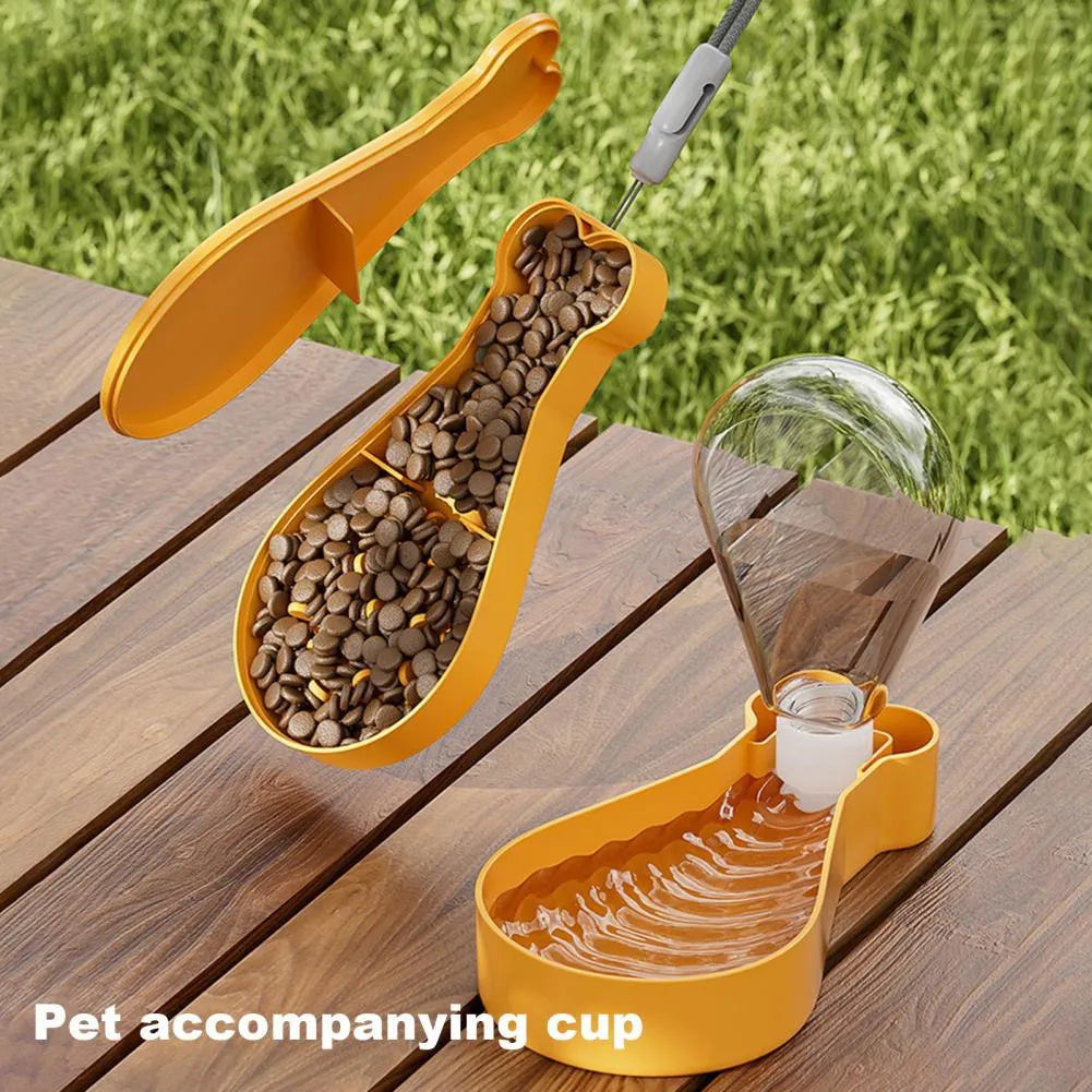 Portable 2-in-1 pet water feeder in orange with water bottle and food container compartments, shortened sling for carrying