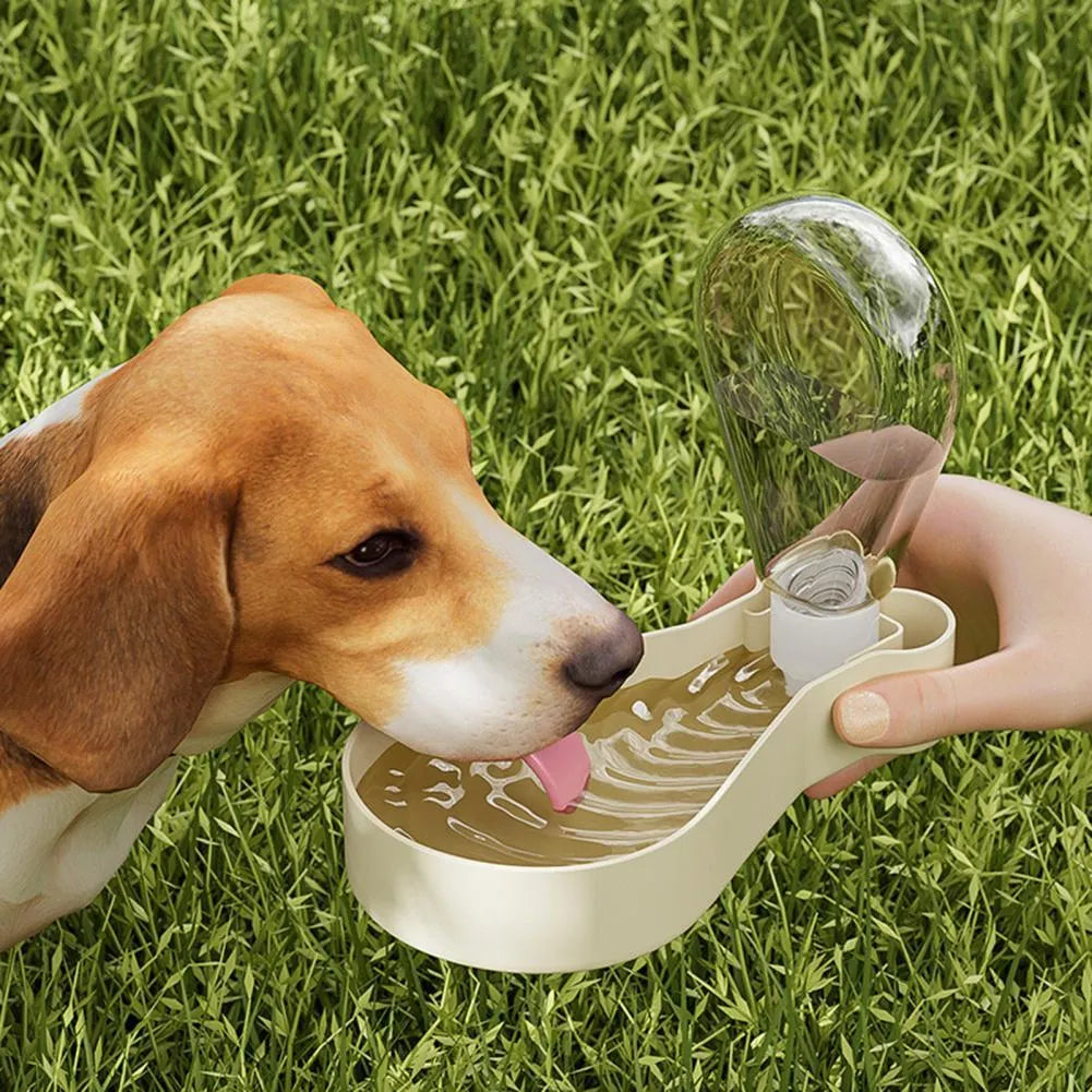 Portable 2-in-1 pet water feeder in orange with water bottle and food container compartments, shortened sling for carrying